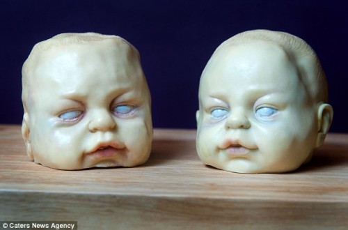 Baby heads made of white chocolate, from cake artist Annabel de Vetten.